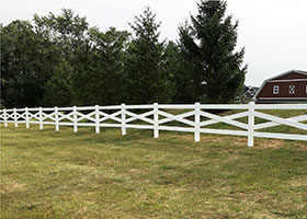 white crossbuck fence
