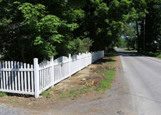 Olympia Arched Tan Vinyl Picket Fence