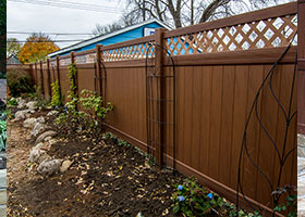 mocha walnut wood grain privacy fence