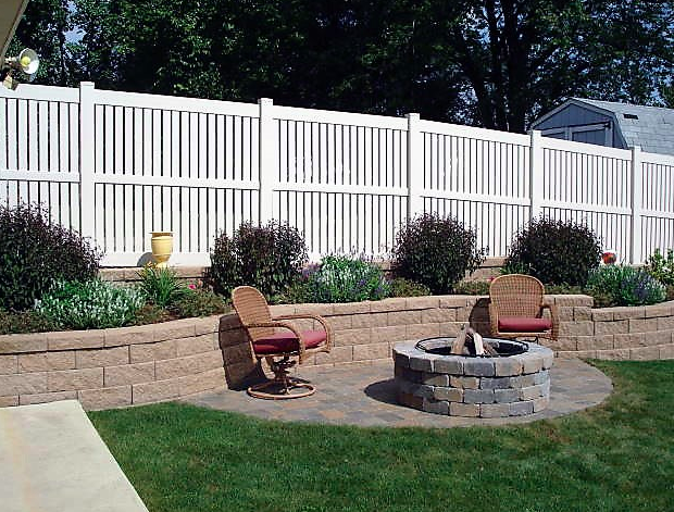 A white vinyl semi-privacy fence