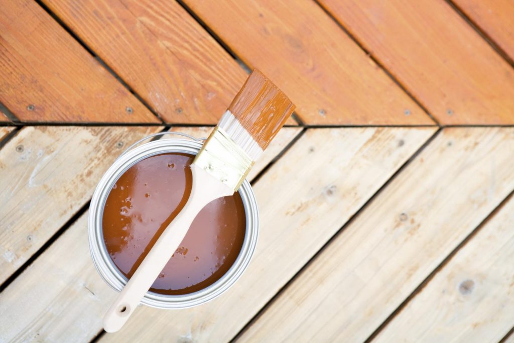 A wood deck before and after staining