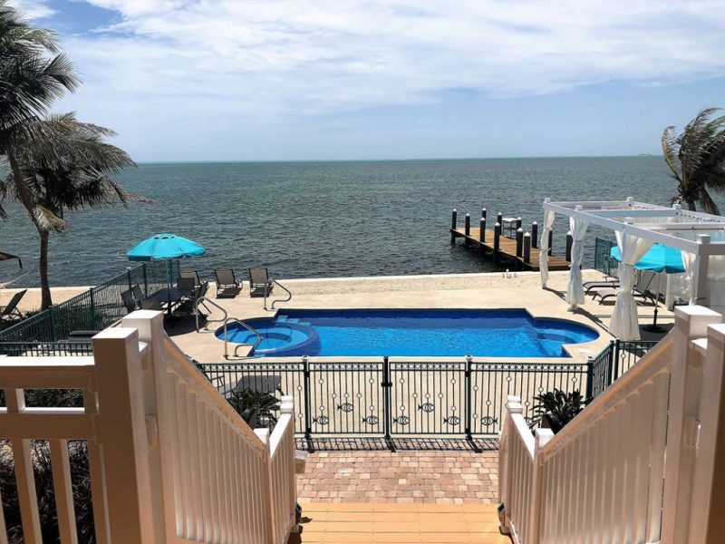 Vinyl deck, fence and railing in a back yard along the coast of an ocean