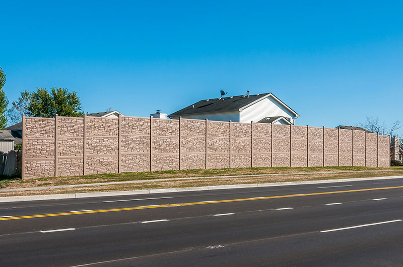 vinyl fence blocking a home from a busy road