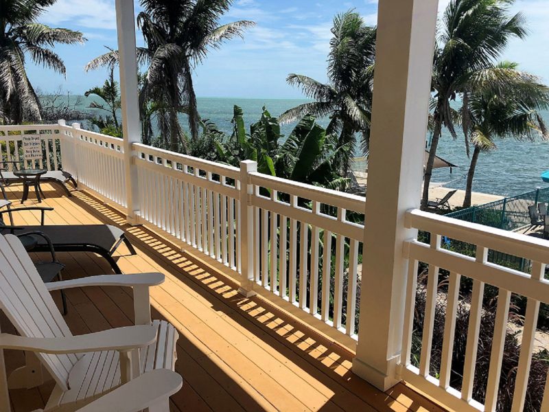 White vinyl railing on a deck on a home near the beach