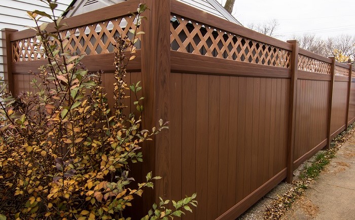Mocha Walnut vinyl fence plus Woodgrain privacy fence
